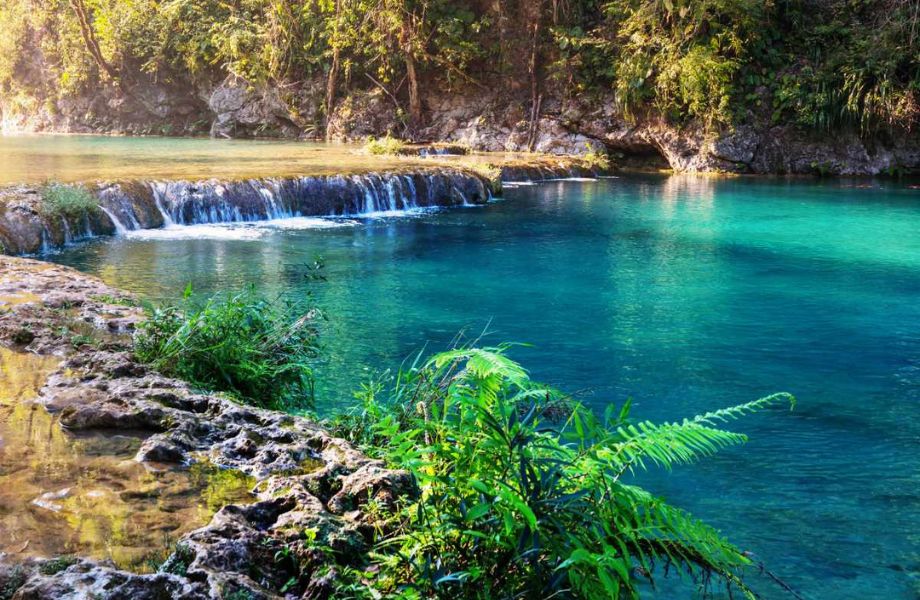 Mesmerizing natural pools of Semuc Champey in Guatemala, a paradise of crystal-clear waters nestled amid lush greenery.