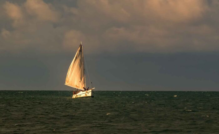 Scenic sunset sailboat cruise featured in our Belize tailor-made vacation package