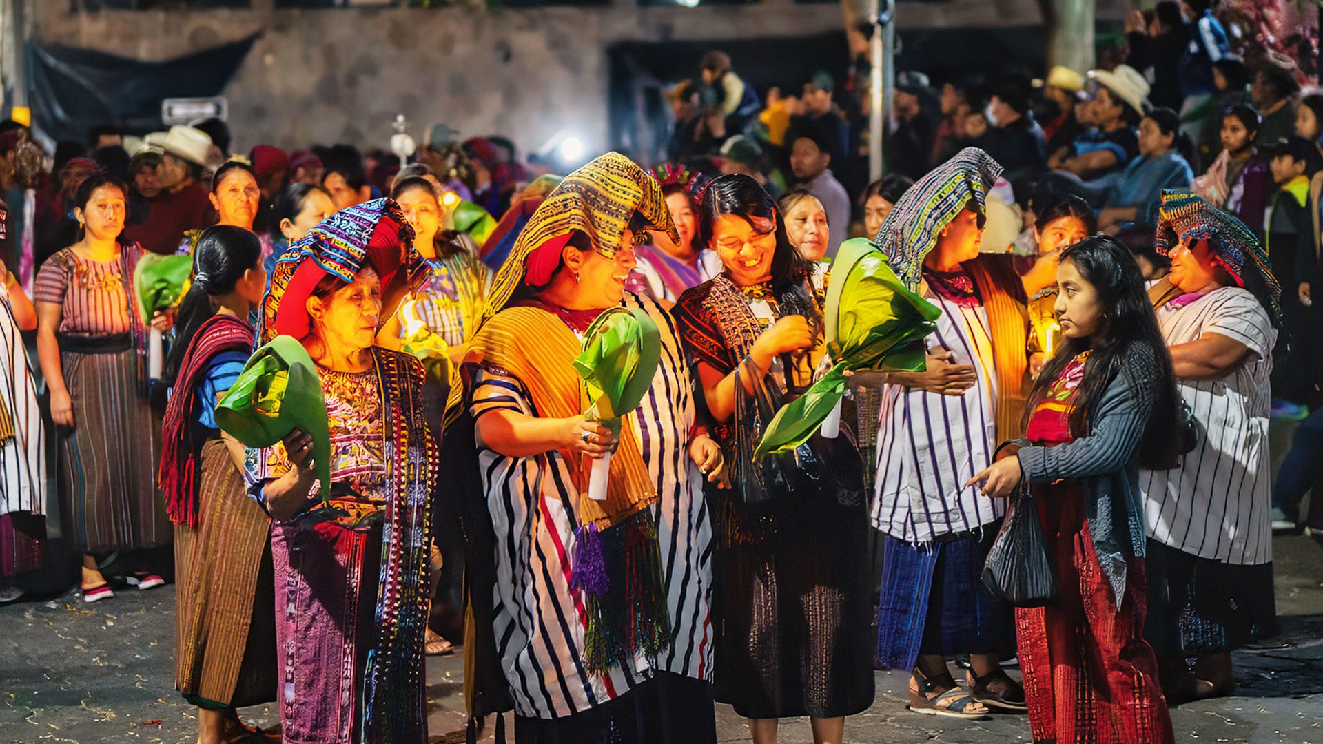 Cultural Immersion Guatemala: Maya women in ceremonial dress celebrating a vibrant festival at Lake Atitlan. Photo by Martsam Travel.