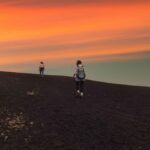 Adventurers reaching the peak of Pacaya volcano during the sunset as a part of the Guatemala Hiking Trails